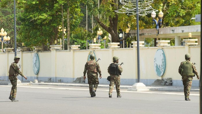 Soldiers patrol in front of the headquarters of Benin's radio and television station, after, according to Benin's Interior Minister, the country's armed forces thwarted the attempted coup against the government of Benin's President Patrice Talon, in Cotonou, Benin, December 7, 2025. REUTERS/Charles Placide Tossou TPX IMAGES OF THE DAY