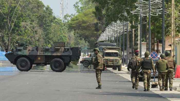 Soldiers patrol in front of the headquarters of Benin's radio and television station, after, according to Benin's Interior Minister, the country's armed forces thwarted the attempted coup against the government of Benin's President Patrice Talon, in Cotonou, Benin, December 7, 2025. REUTERS/Charles Placide Tossou     TPX IMAGES OF THE DAY