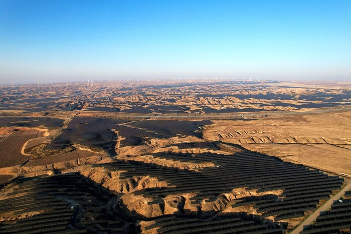 WUZHONG, CHINA - DECEMBER 08: An aerial view shows of rows of solar panels delivering green electricity on the Gobi Desert on December 8, 2025 in Wuzhong, Ningxia Hui Autonomous Region of China. In recent years, Ningxia has fully utilized land resources such as deserts and wastelands to develop the clean energy industry, underscoring its commitment to benefit the environment and the local community. (Photo by Zhou Xupeng/VCG via Getty Images)