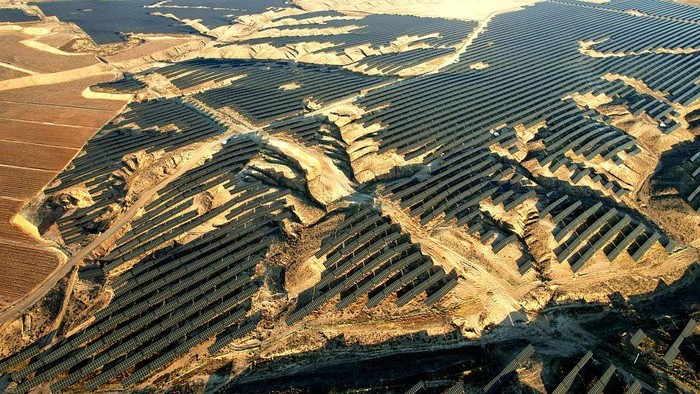 WUZHONG, CHINA - DECEMBER 08: An aerial view shows of rows of solar panels delivering green electricity on the Gobi Desert on December 8, 2025 in Wuzhong, Ningxia Hui Autonomous Region of China. In recent years, Ningxia has fully utilized land resources such as deserts and wastelands to develop the clean energy industry, underscoring its commitment to benefit the environment and the local community. (Photo by Zhou Xupeng/VCG via Getty Images)