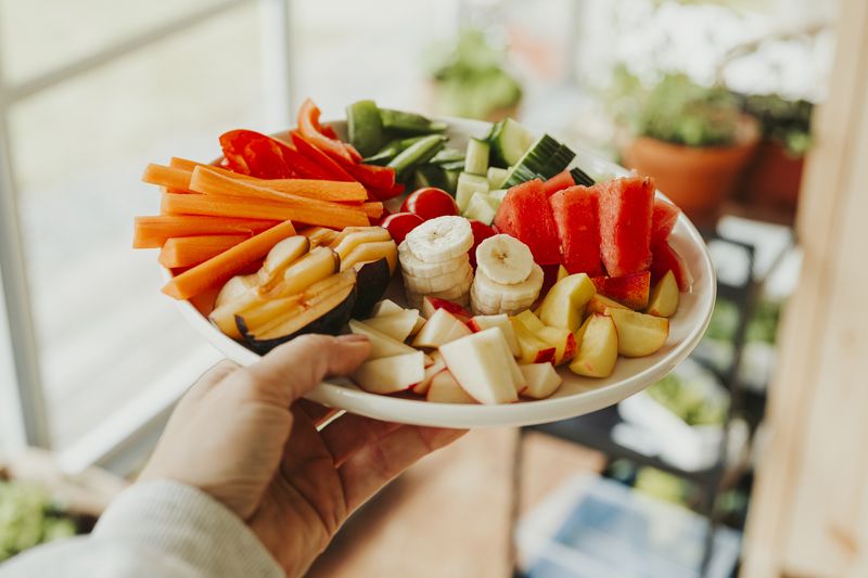 Raw vegetables and fruit thats good for gut heatlh microbiomePlate of many various greens and fruits