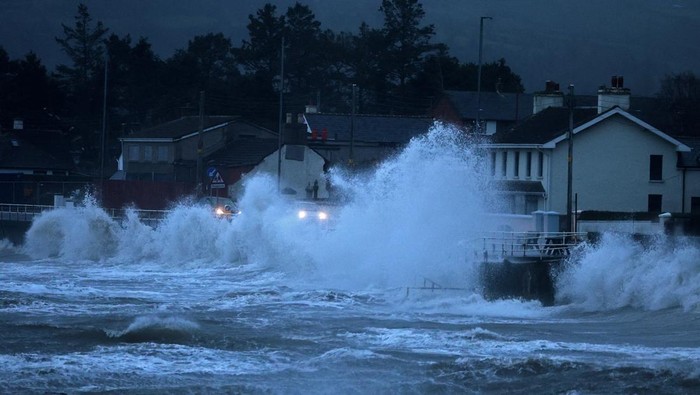Waves crash against the sea wall as Storm Bram brings widespread weather warnings, heavy rain and high winds across the United Kingdom, in Carnlough, Northern Ireland December 9, 2025. REUTERS/Cathal McNaughton