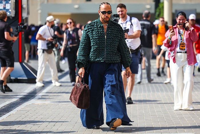 ABU DHABI, UNITED ARAB EMIRATES - DECEMBER 07: Lewis Hamilton of Great Britain and Scuderia Ferrari arrives in the Paddock prior to the F1 Grand Prix of Abu Dhabi at Yas Marina Circuit on December 07, 2025 in Abu Dhabi, United Arab Emirates. (Photo by Clive Mason/Getty Images)