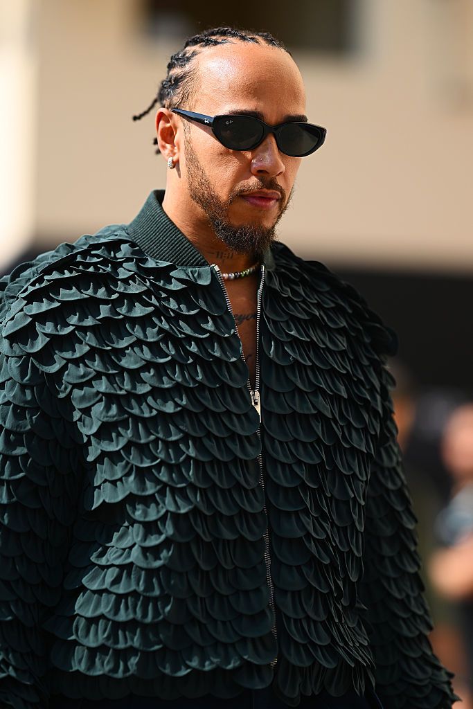 ABU DHABI, UNITED ARAB EMIRATES - DECEMBER 07: Lewis Hamilton of Great Britain and Scuderia Ferrari arrives in the Paddock prior to the F1 Grand Prix of Abu Dhabi at Yas Marina Circuit on December 07, 2025 in Abu Dhabi, United Arab Emirates. (Photo by Clive Mason/Getty Images)