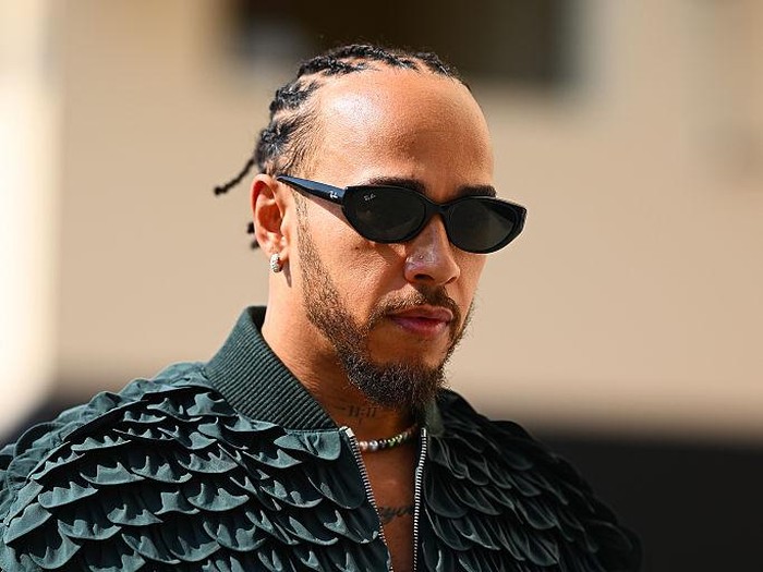 ABU DHABI, UNITED ARAB EMIRATES - DECEMBER 07: Lewis Hamilton of Great Britain and Scuderia Ferrari arrives in the Paddock prior to the F1 Grand Prix of Abu Dhabi at Yas Marina Circuit on December 07, 2025 in Abu Dhabi, United Arab Emirates. (Photo by Clive Mason/Getty Images)