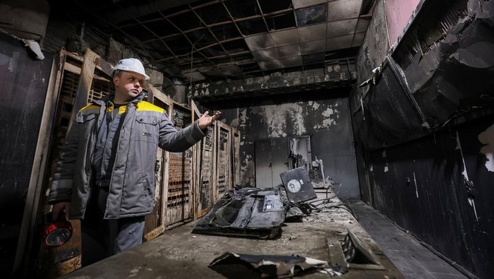 An employee walks at a thermal power plant damaged by recent Russian missile and drone strike, amid Russia's attack on Ukraine, in an undisclosed location of Ukraine December 10, 2025. REUTERS/Roman Baluk