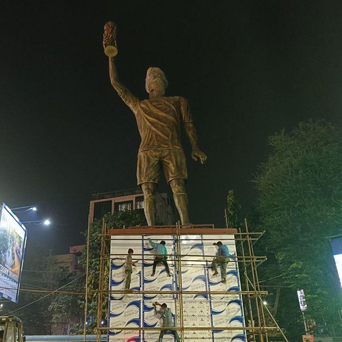 A 50-foot statue of Lionel Messi holding the FIFA World Cup trophy has pride of place next to it in the citys Lake Town area, after a virtual inauguration by the global football icon during his visit to Kolkata, India, on December 10, 2025. (Photo by Debajyoti Chakraborty/NurPhoto via Getty Images)