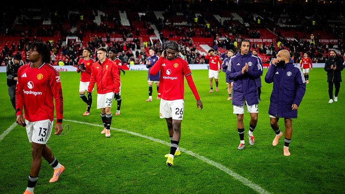 MANCHESTER, ENGLAND - DECEMBER 15: Tyrell Malacia, Patrick Chinazaekpere Dorgu, Ayden Heaven, Leny Yoro and Bryan Mbuemo of Manchester United applaud the fans after the Premier League match between Manchester United and Bournemouth at Old Trafford on December 15, 2025 in Manchester, England. (Photo by Ash Donelon/Manchester United via Getty Images)