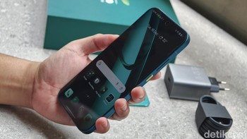 Realme turut memberikan tema khusus bernuansa tim F1 Aston Martin Aramco.Foto: Adi Fida Rahman/detikINET