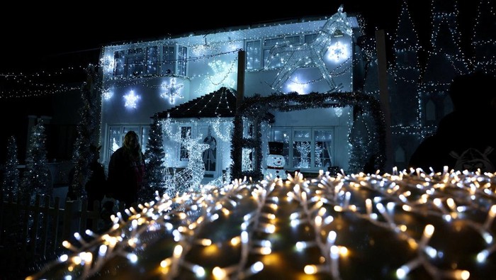 A house lit with Christmas lights display, decorated every year by Owen Gibbs to raise money for charity, in Feltham, Britain, December 10, 2025. REUTERS/Isabel Infantes     TPX IMAGES OF THE DAY