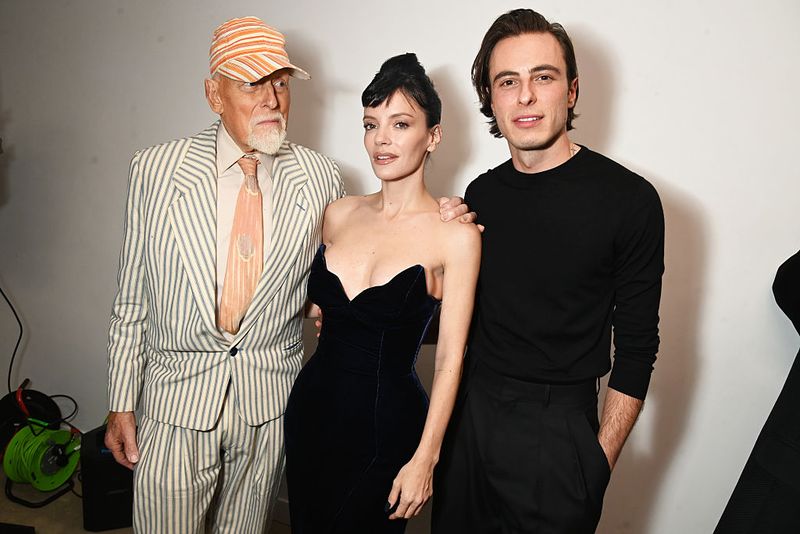LONDON, ENGLAND - NOVEMBER 17: (L to R) Antony Price, Lily Allen and Marco Capaldo pose backstage at the 16Arlington x Antony Price Salon Show on November 17, 2025 in London, England. (Photo by Dave Benett/Getty Images)