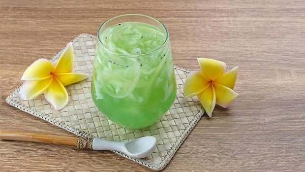 Es kuwut Es Kuwut, traditional Balinese fruit cocktail made from young coconut, melon, nata de coco, basil seeds, lime and syrup. Space for text