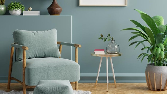 Mock up poster in modern living room interior design with dark green empty wall.3d rendering