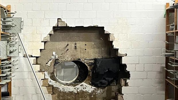This picture, provided by the Gelsenkirchen Police on Monday, Dec. 29, 2025 shows a hole in a wall of the savings bank branch in the Buer district in Gelsenkirchen, Germany. (Police Gelsenkirchen via AP)
