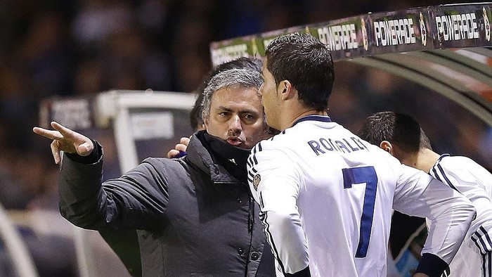 LA CORUNA, SPAIN - FEBRUARY 23: Head coach Jose Mourinho (L) of Real Madrid and Cristiano Ronaldo give game instructions  during the La Liga match between Deportivo La Coruna and Real Madrid at Riazor Stadium on February 23, 2013 in La Coruna, Spain. (Photo by Helios de la Rubia/Real Madrid via Getty Images)
