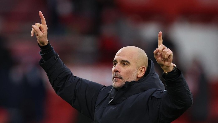 Soccer Football - Premier League - Nottingham Forest v Manchester City - The City Ground, Nottingham, Britain - December 27, 2025 Manchester City manager Pep Guardiola celebrates after the match REUTERS/Chris Radburn EDITORIAL USE ONLY. NO USE WITH UNAUTHORIZED AUDIO, VIDEO, DATA, FIXTURE LISTS, CLUB/LEAGUE LOGOS OR LIVE SERVICES. ONLINE IN-MATCH USE LIMITED TO 120 IMAGES, NO VIDEO EMULATION. NO USE IN BETTING, GAMES OR SINGLE CLUB/LEAGUE/PLAYER PUBLICATIONS. PLEASE CONTACT YOUR ACCOUNT REPRESENTATIVE FOR FURTHER DETAILS..