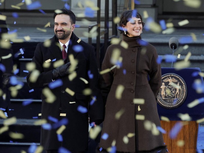New York City Mayor Zohran Mamdani and his wife Rama Duwaji react as confetti falls during his inauguration ceremony in New York City, U.S., January 1, 2026. REUTERS/Jeenah Moon