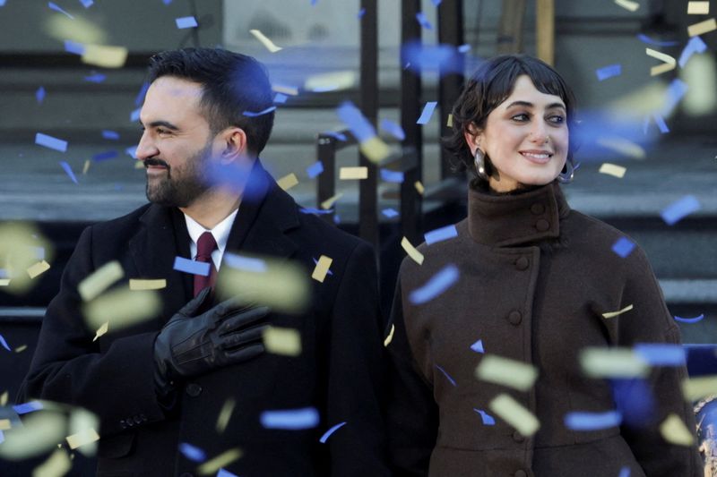 New York City Mayor Zohran Mamdani and his wife Rama Duwaji stand onstage during his inauguration ceremony in New York City, U.S., January 1, 2026. REUTERS/Kylie Cooper