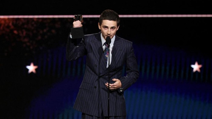 Timothee Chalamet accepts the Best Actor Award for 