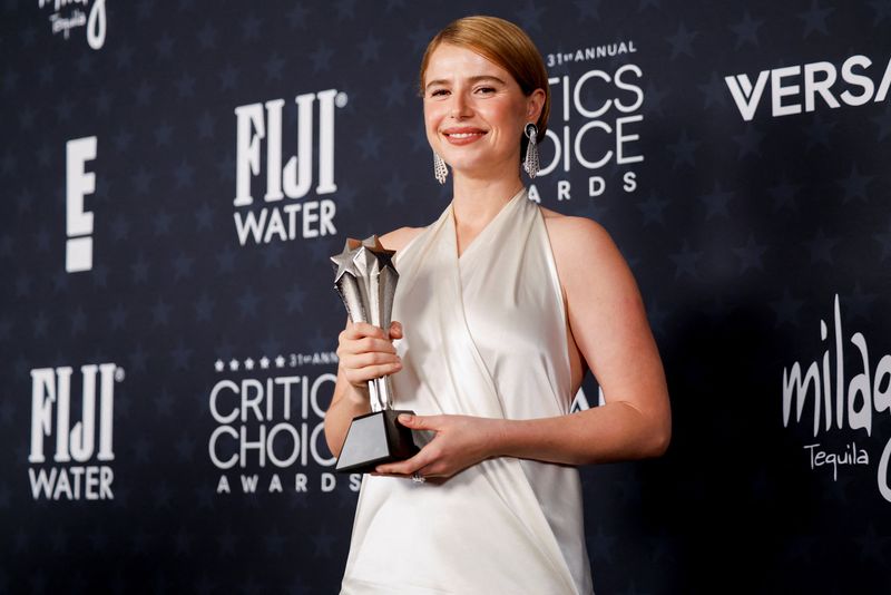 Jessie Buckley poses with the Best Actress award for 
