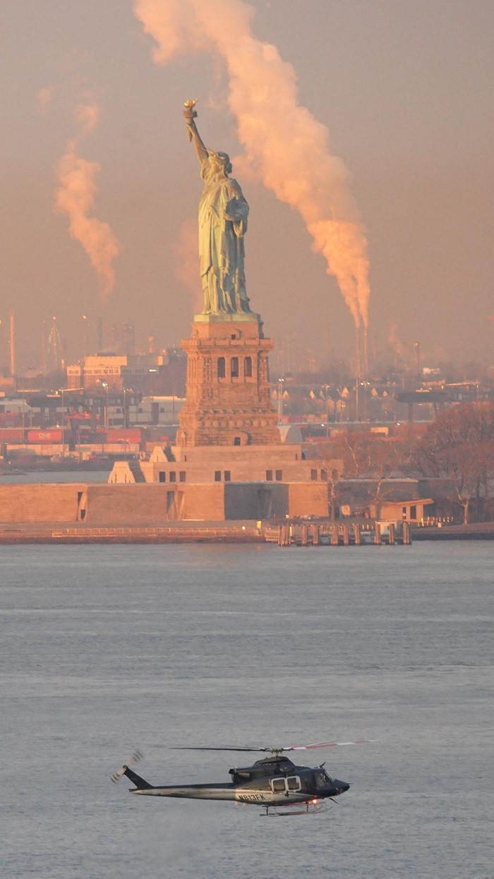 Law enforcement officials move captured Venezuelan President Nicolas Maduro and his wife Cilia Flores out of the helicopter, as Maduro heads towards the Daniel Patrick Manhattan United States Courthouse for an initial appearance to face U.S. federal charges including narco-terrorism, conspiracy, drug trafficking, money laundering and others in New York City, U.S., January 5, 2026. REUTERS/Adam Gray