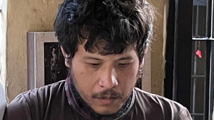 Tampang pengemudi ojol yang gadaikan laptop pelanggannya.