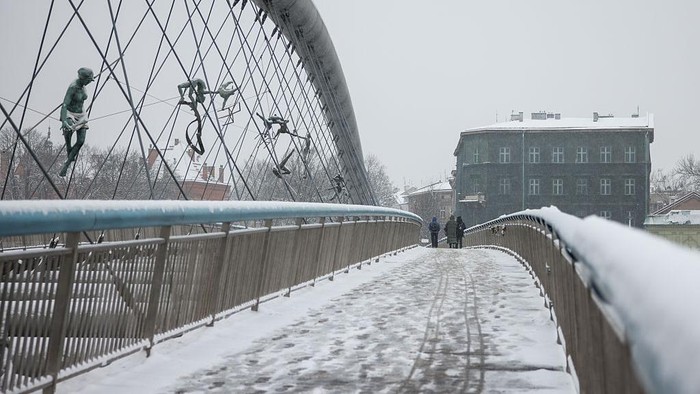 Father Bernatek Footbridge is covered with snow in Krakow, Poland on January 8th, 2026.  (Photo by Beata Zawrzel/NurPhoto via Getty Images)