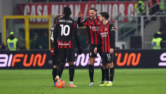 MILAN, ITALY - JANUARY 08: Christian Pulisic celebrates after scoring his teams first goal with teammates Rafael Leao and Adrien Rabiot, but the goal will be disallowed during the Serie A match between AC Milan and Genoa CFC at Giuseppe Meazza Stadium on January 08, 2026 in Milan, Italy. (Photo by Giuseppe Cottini/AC Milan via Getty Images)