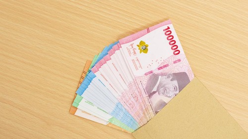 One hundred thousand rupiah money (Rp. 100.000 Seratus Ribu Rupiah), Indonesian currency financial money management concept.