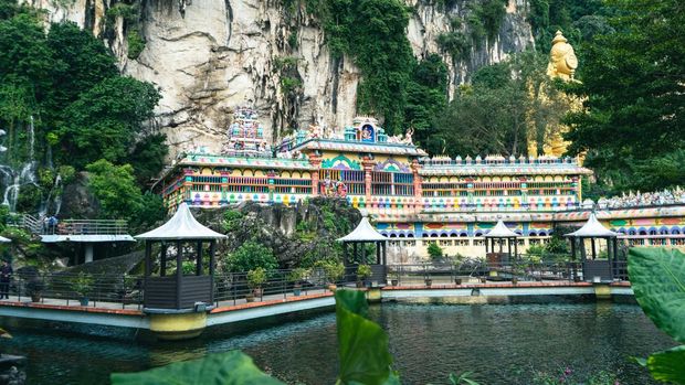 KUALA LUMPUR, MALAYSIA - OCTOBER 8: A general view from Batu Caves, one of the significant pilgrimage centers for Hindus with its temples in Kuala Lumpur, Malaysia on October 8, 2022. The caves are estimated to have formed on the limestone hill about 400 million years ago. Monkeys, attracting great attention of tourists at the temple, frequently steal items and foods from humans. (Photo by Idris Sulun/Anadolu Agency via Getty Images)