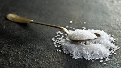 the silver spoon with white salt
