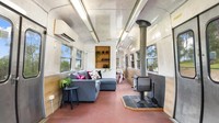 Lalu, terdapat area duduk yang dilengkapi sofa. Foto: via realestate.com.au