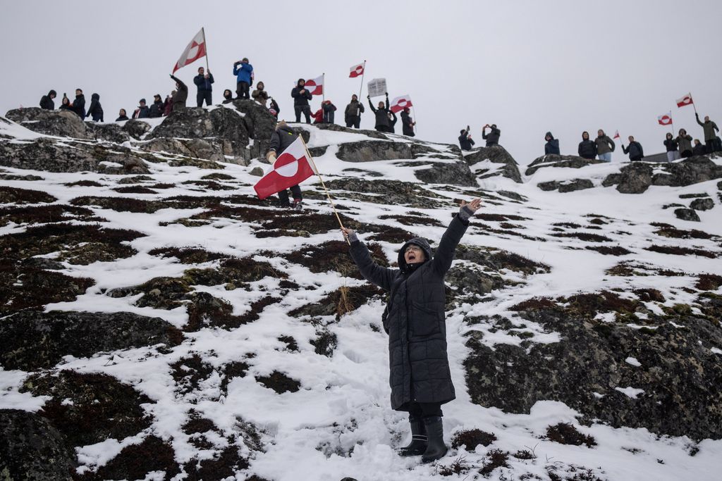 People attend a protest against U.S. President Donald Trump's demand that the Arctic island be ceded to the U.S., calling for it to be allowed to determine its own future, in Nuuk, Greenland, January 17, 2026. REUTERS/Marko Djurica     TPX IMAGES OF THE DAY
