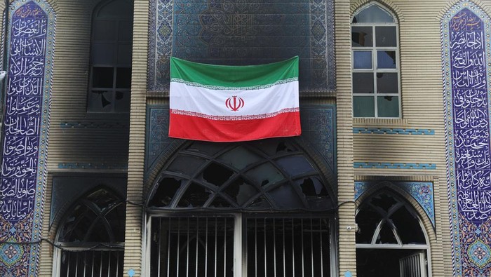 Iranian clerics stand in the Islamic seminary that was burned during Iran's protests, in Tehran, Iran, January 21, 2026. Majid Asgaripour/WANA (West Asia News Agency) via REUTERS ATTENTION EDITORS - THIS PICTURE WAS PROVIDED BY A THIRD PARTY     TPX IMAGES OF THE DAY