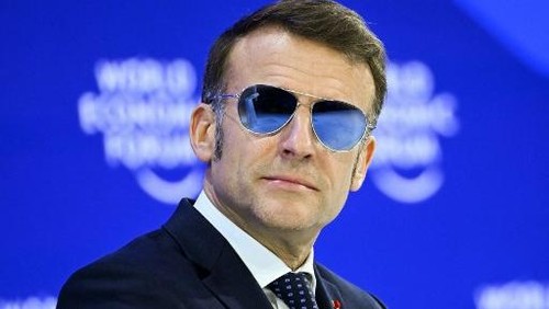 Frances President Emmanuel Macron looks on during the World Economic Forum (WEF) annual meeting in Davos on January 20, 2026. The World Economic Forum takes place in Davos from January 19 to January 23, 2026. (Photo by Fabrice COFFRINI / AFP)