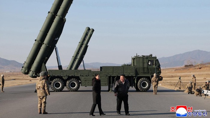 North Korean leader Kim Jong Un, accompanied by his daughter Kim Ju Ae, directs a test of a large-caliber multiple-rocket launch system, in an unknown location, North Korea, January 27, 2026, in this picture released by North Korea's official Korean Central News Agency on January 28, 2026.    KCNA via REUTERS    ATTENTION EDITORS - THIS IMAGE WAS PROVIDED BY A THIRD PARTY. REUTERS IS UNABLE TO INDEPENDENTLY VERIFY THIS IMAGE. NO THIRD PARTY SALES. SOUTH KOREA OUT. NO COMMERCIAL OR EDITORIAL SALES IN SOUTH KOREA.
