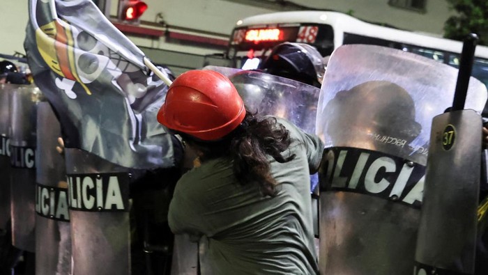 Demonstrators, including members of a youth collective called 