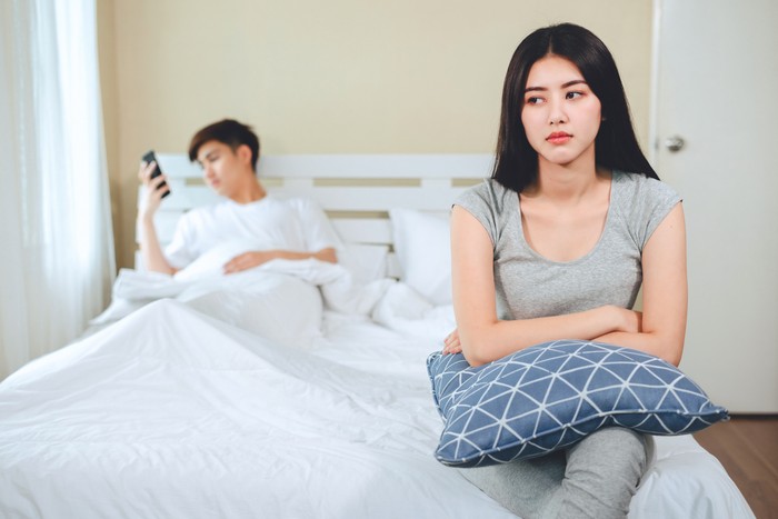 unhappy young asian couple have problems in relationships.