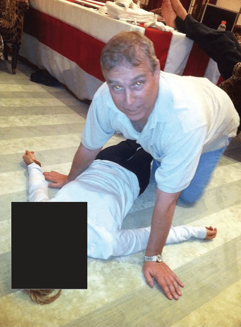 Britain's Prince Andrew kneels over a female in this image released by the Department of Justice in Washington, D.C., U.S., on January 30, 2026 as part of a new trove of documents from its investigations into the late financier and convicted sex offender Jeffrey Epstein. U.S. Justice Department/Handout via REUTERS   THIS IMAGE HAS BEEN SUPPLIED BY A THIRD PARTY. REDACTED AREAS FROM SOURCE.