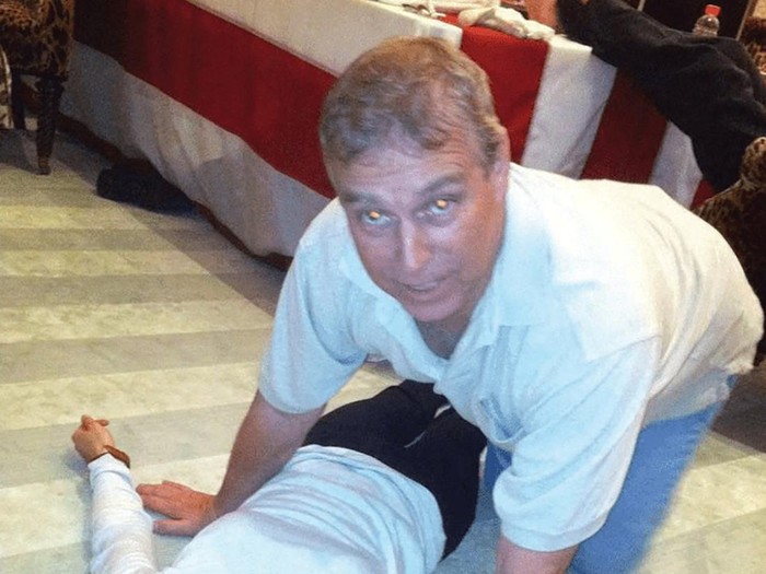 Britains Prince Andrew kneels over a female in this image released by the Department of Justice in Washington, D.C., U.S., on January 30, 2026 as part of a new trove of documents from its investigations into the late financier and convicted sex offender Jeffrey Epstein. U.S. Justice Department/Handout via REUTERS   THIS IMAGE HAS BEEN SUPPLIED BY A THIRD PARTY. REDACTED AREAS FROM SOURCE.