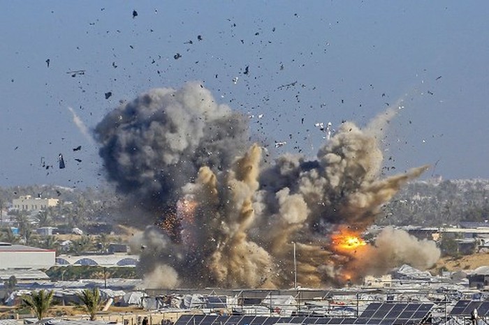 Smoke and fire rises from the Gath shelter, housing displaced Palestinians, after an Israeli air strike in the west of Khan Yunis, southern Gaza Strip on January 31, 2026. Israeli air strikes killed 11 people in the Gaza Strip on January 31, according to the territorys ministry of health, including people sheltering in a tent in the south. (Photo by Bashar Taleb / AFP)