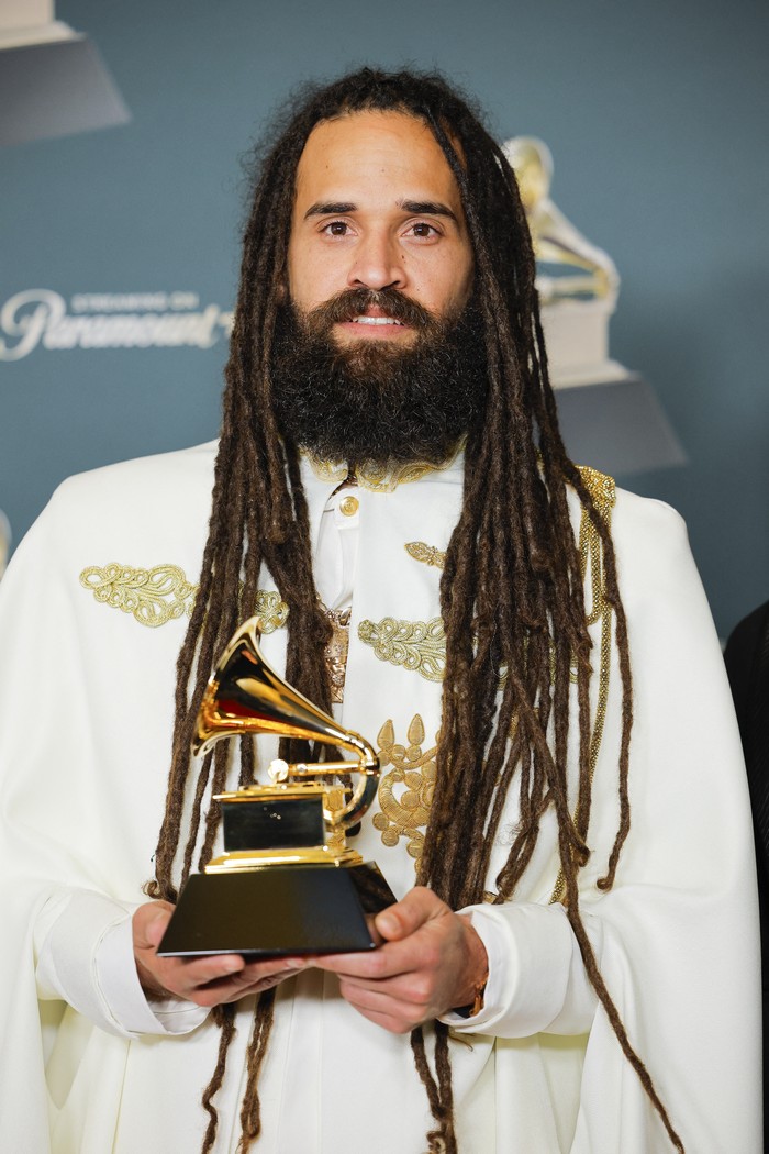 Keznamdi poses with the Best Reggae Album award for 
