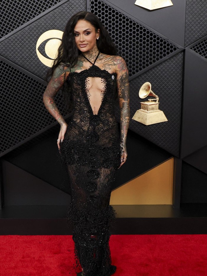 Meg Pickarski and Curtis Stewart pose at the red carpet during the 68th Annual Grammy Awards in Los Angeles, California, U.S., February 1, 2026. REUTERS/Mario Anzuoni