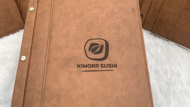 Khalisha Kyandhra Putri Haryadi yang memproduksi buku menu untuk restoran.