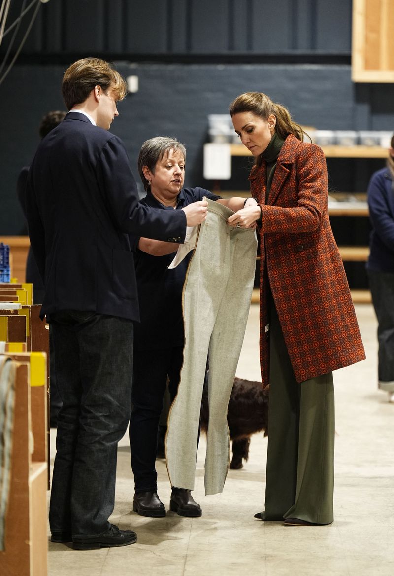 The Princess of Wales is shown an article of clothing during a visit to Hiut Denim, a family-owned company based in Cardigan, designing and manufacturing premium jeans entirely in the UK, on February 3, 2026 in Cardigan, Wales, Britain. Aaron Chown/Pool via REUTERS