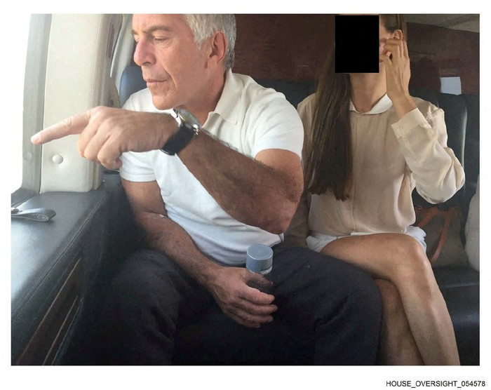 Late financier and convicted sex offender Jeffrey Epstein appears with a woman, whose identity has been obscured, in this image from the Epstein estate released by House Oversight Committee Democrats in Washington, D.C., U.S., on December 18, 2025. House Oversight Committee Democrats/Handout via REUTERS  THIS IMAGE HAS BEEN SUPPLIED BY A THIRD PARTY. REDACTED AREA FROM SOURCE.     TPX IMAGES OF THE DAY