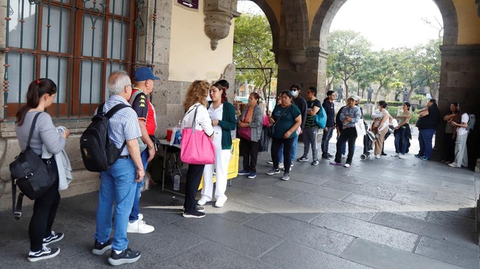 A nurse gives a measles vaccine to a woman with a Frida Kahlo tattoo, as health authorities said that Jalisco faces a growing outbreak, mandated masks in basic education campuses and recommended them in higher secondary and secondary education campuses, in Guadalajara, Mexico, February 8, 2026. REUTERS/Michelle Freyria      TPX IMAGES OF THE DAY