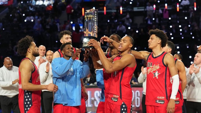 Feb 15, 2026; Inglewood, California, USA; Team USA Stars guard Anthony Edwards (5) of the Minnesota Timberwolves and forward Scottie Barnes (4) of the Toronto Raptors lift the trophy after defeating Team Stripes during the 75th NBA All Star Game at I