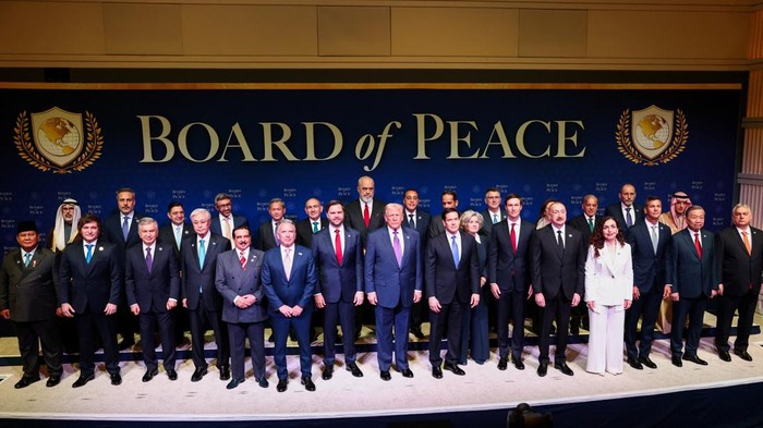 U.S President Donald Trump, U.S. Vice President JD Vance, and U.S. Secretary of State Marco Rubio pose for a family photo with other representatives participating in the inaugural Board of Peace meeting, at the U.S. Institute of Peace in Washington, 