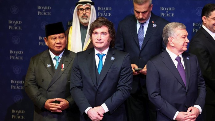 Argentina's President Javier Milei, Indonesia's President Prabowo Subianto, Turkish Foreign Minister Hakan Fidan, Uzbekistan's President Shavkat Mirziyoyev stand for a family photo during the inaugural meeting of the Board of Peace at the U.S. Institute of Peace in Washington, D.C., U.S., February 19, 2026. REUTERS/Kevin Lamarque